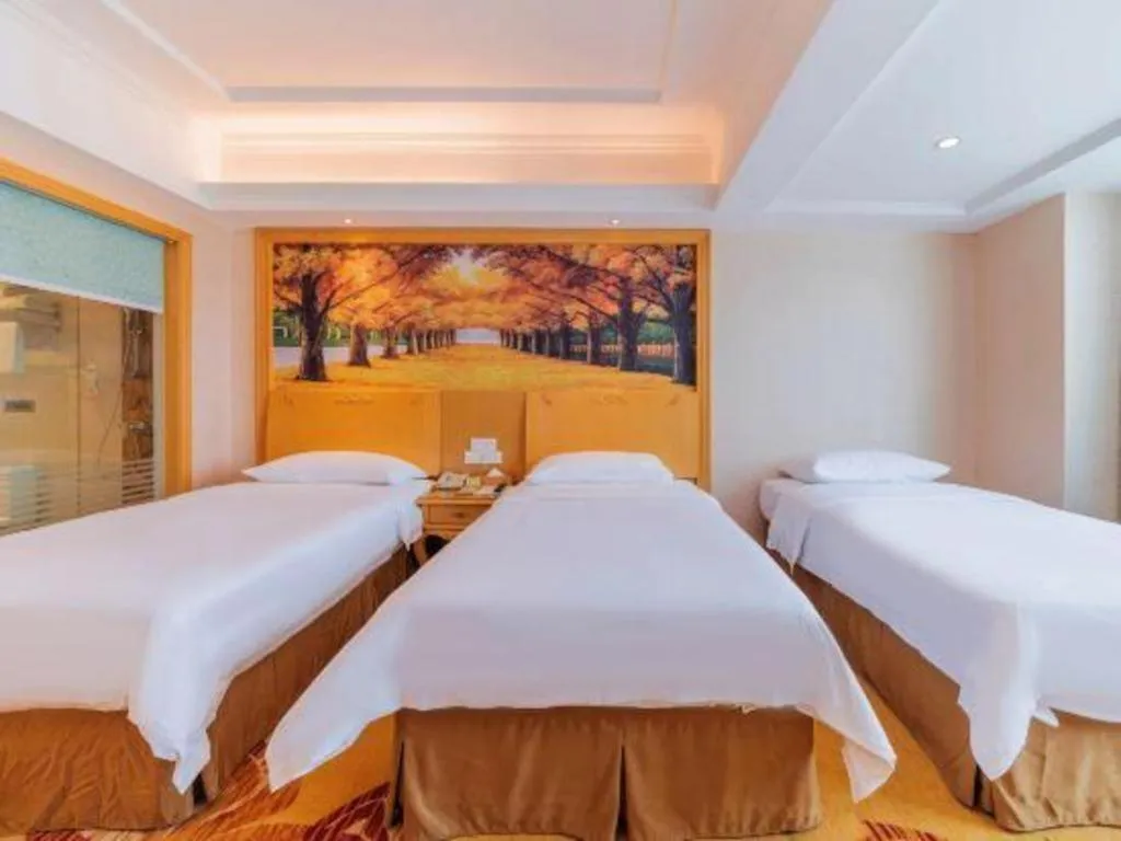 Bed in Vienna Hotel Guangdong Qingyuan Wanda Plaza Xincheng Beijiang
