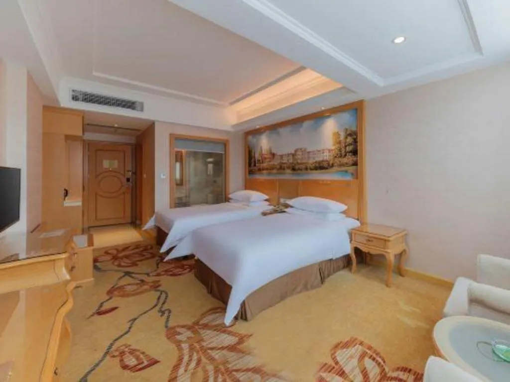 Bed in Vienna Hotel Guangdong Qingyuan Wanda Plaza Xincheng Beijiang
