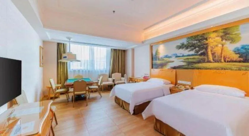 Bed in Vienna Hotel Guangdong Qingyuan Wanda Plaza Xincheng Beijiang