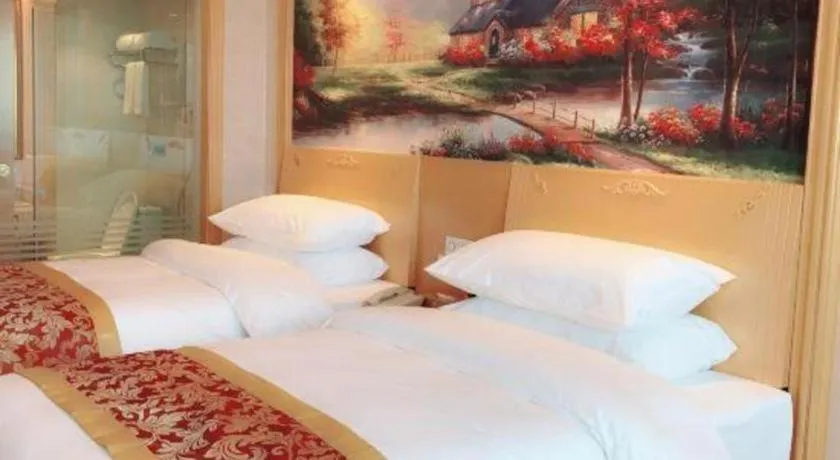 Bed in Vienna Hotel Guangdong Qingyuan Wanda Plaza Xincheng Beijiang