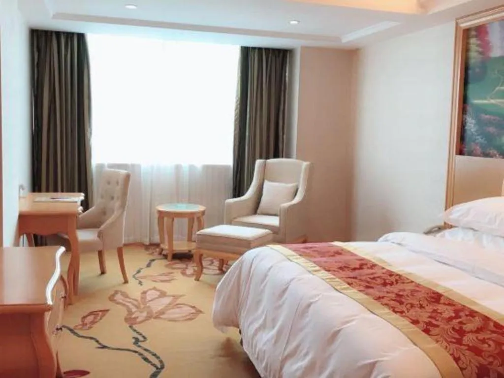 Bed in Vienna Hotel Guangdong Qingyuan Wanda Plaza Xincheng Beijiang
