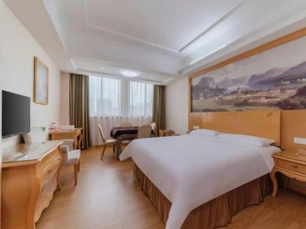 Bed in Vienna Hotel Guangdong Qingyuan Wanda Plaza Xincheng Beijiang