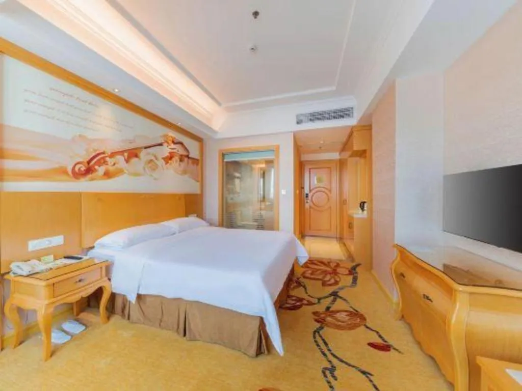 Bed in Vienna Hotel Guangdong Qingyuan Wanda Plaza Xincheng Beijiang