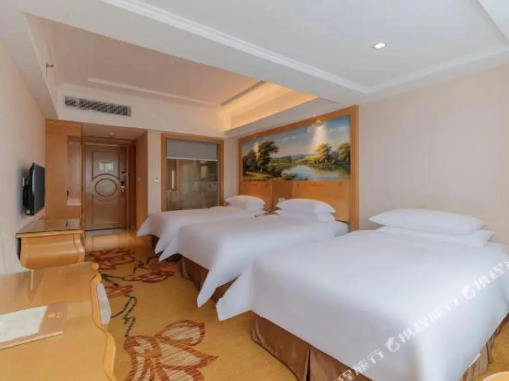 Bed in Vienna Hotel Guangdong Qingyuan Wanda Plaza Xincheng Beijiang