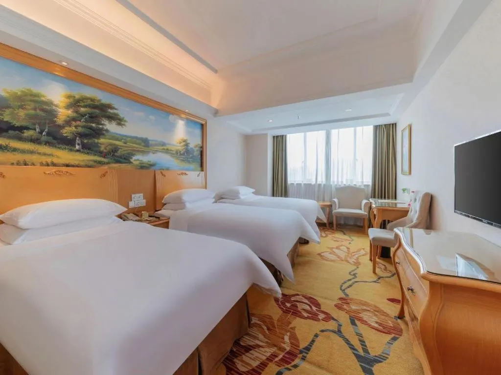 Bed in Vienna Hotel Guangdong Qingyuan Wanda Plaza Xincheng Beijiang