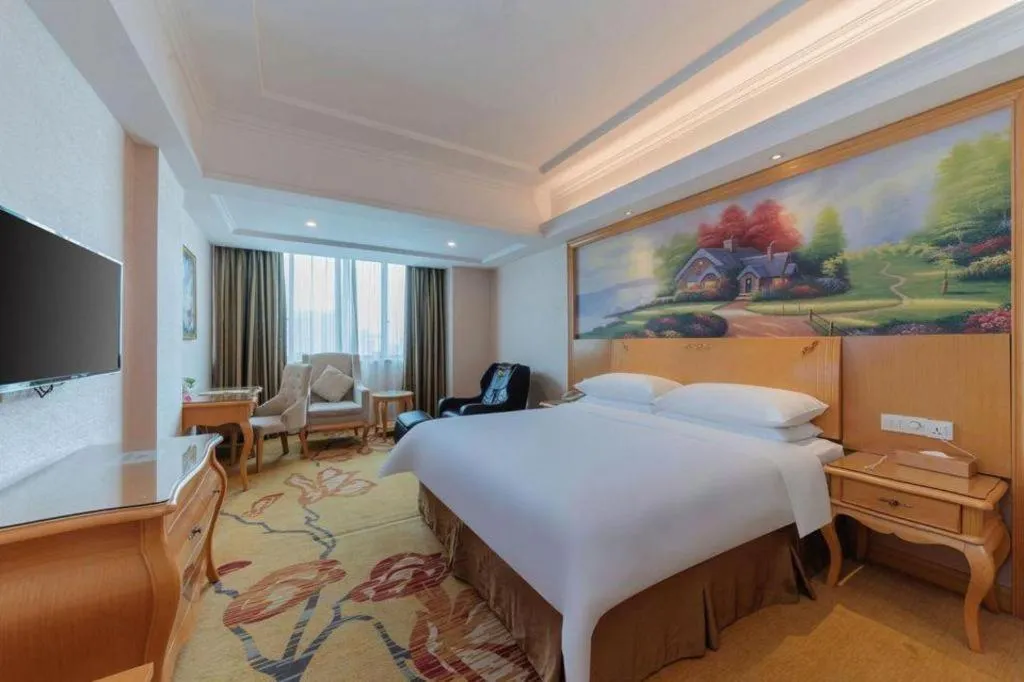 Bed in Vienna Hotel Guangdong Qingyuan Wanda Plaza Xincheng Beijiang