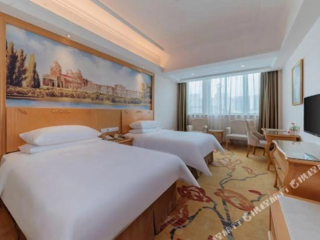Bed in Vienna Hotel Guangdong Qingyuan Wanda Plaza Xincheng Beijiang