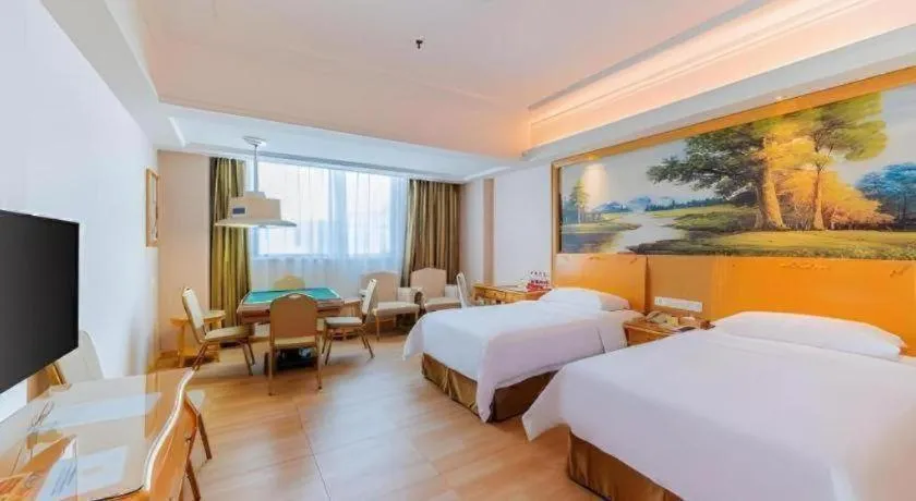 Bed in Vienna Hotel Guangdong Qingyuan Wanda Plaza Xincheng Beijiang