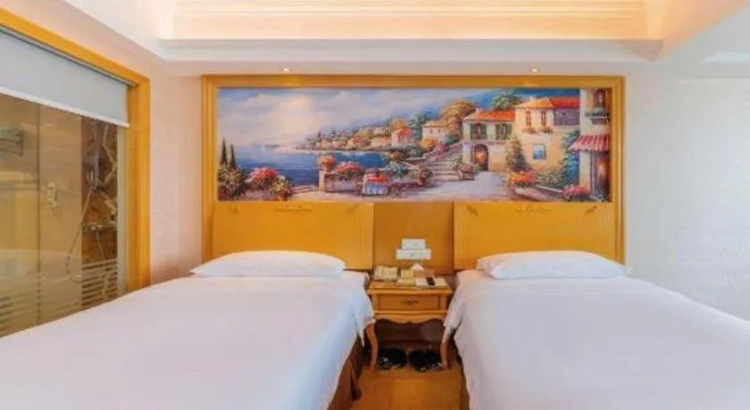 Bed in Vienna Hotel Guangdong Qingyuan Wanda Plaza Xincheng Beijiang