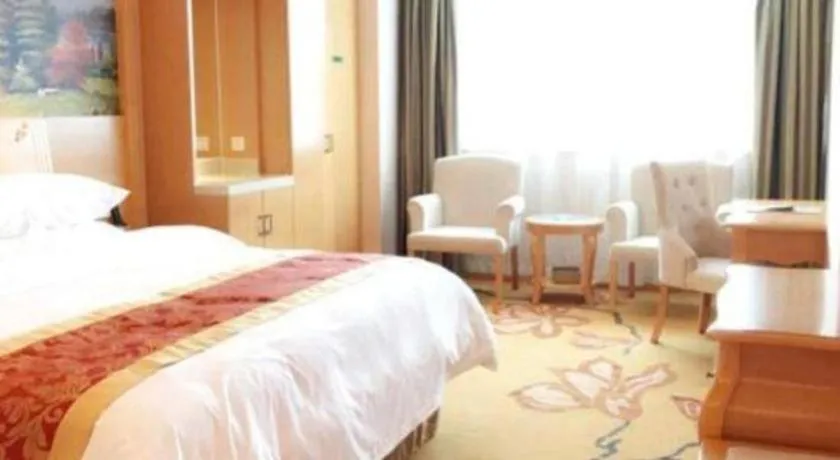 Bed in Vienna Hotel Guangdong Qingyuan Wanda Plaza Xincheng Beijiang