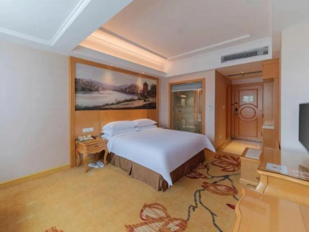 Bed in Vienna Hotel Guangdong Qingyuan Wanda Plaza Xincheng Beijiang