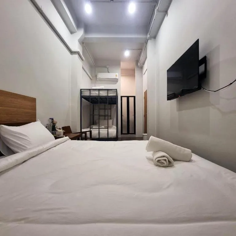 Bed in Sirichai Design Hotel