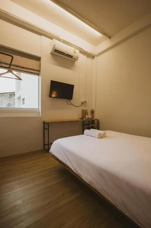 Bed in Sirichai Design Hotel