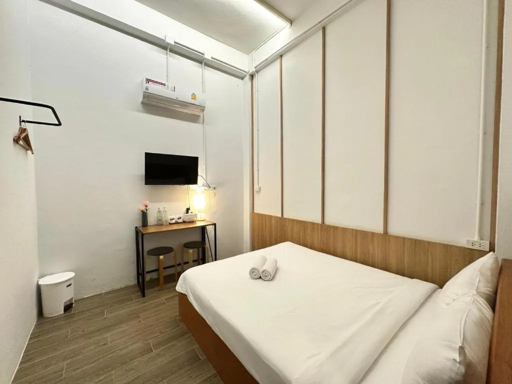 Bed in Sirichai Design Hotel