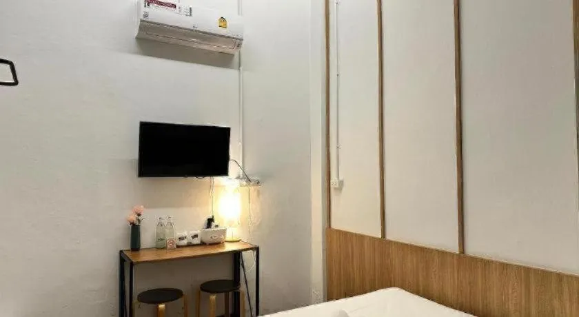 Bed in Sirichai Design Hotel