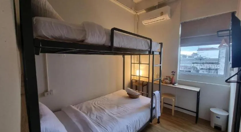 Bed in Sirichai Design Hotel