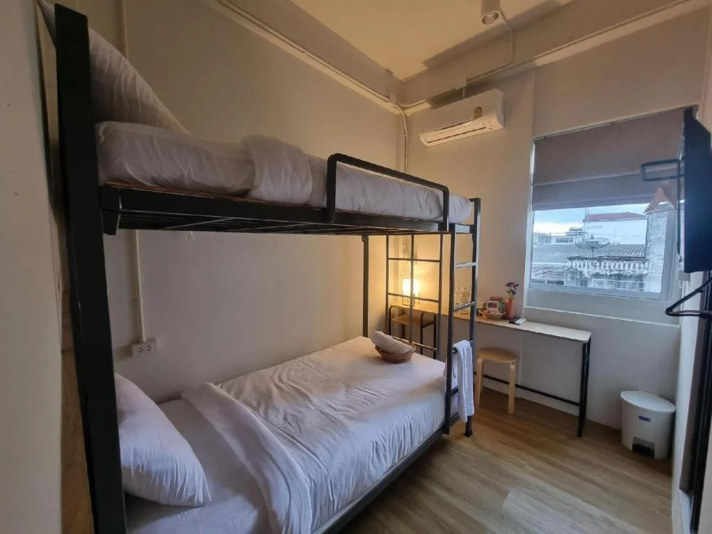 Bed in Sirichai Design Hotel