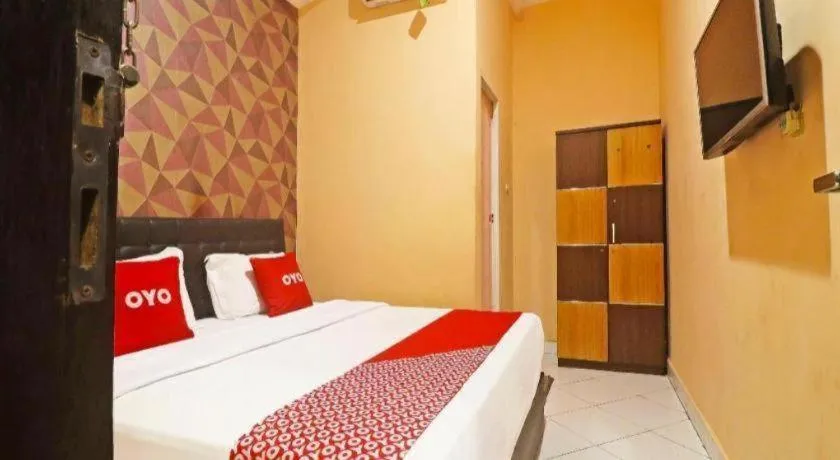 Bed in Hotel O Papi Inn Guesthouse