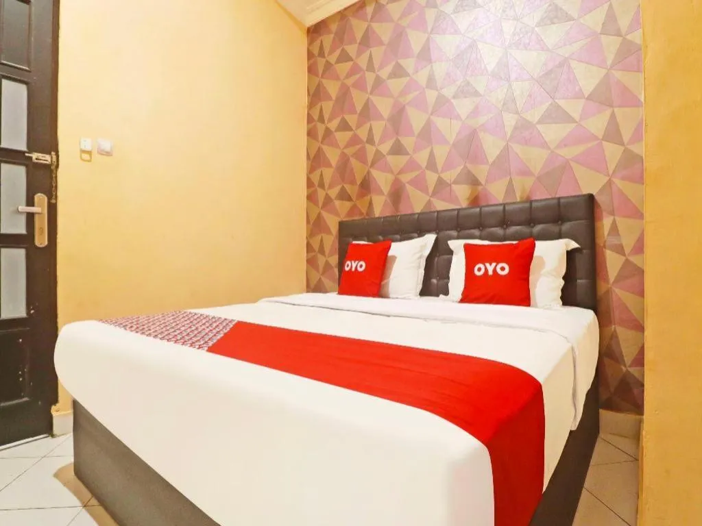 Bed in Hotel O Papi Inn Guesthouse