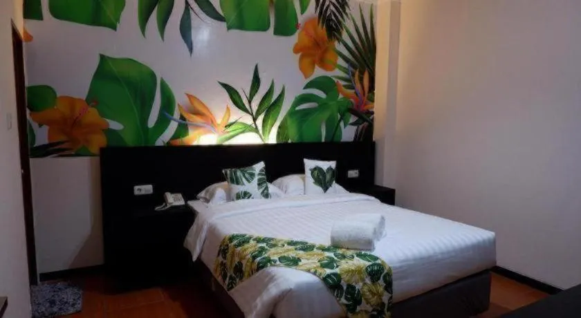 Bed in Tropical Point Hotel Syariah