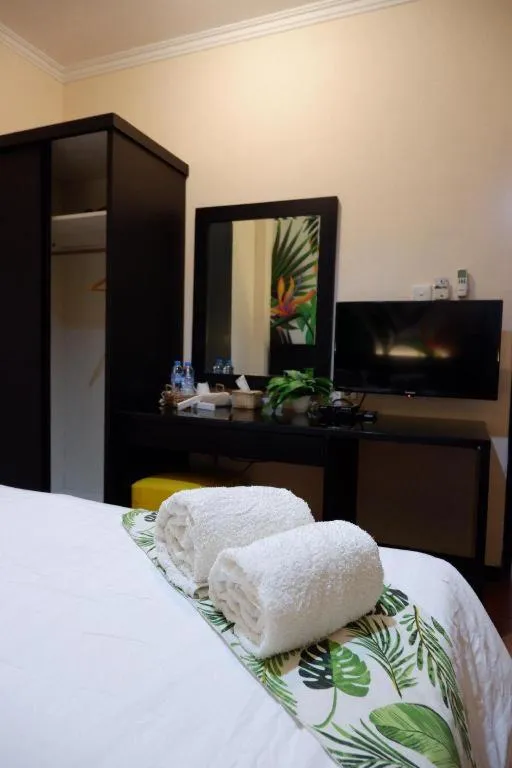 Bed in Tropical Point Hotel Syariah