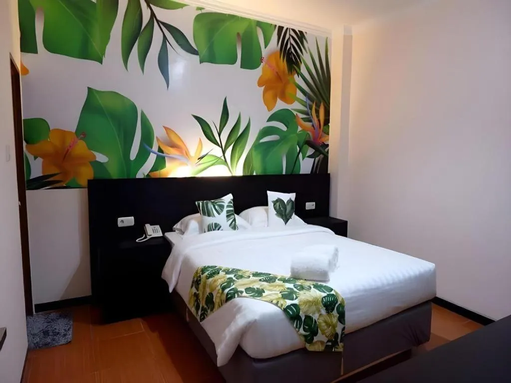 Bed in Tropical Point Hotel Syariah