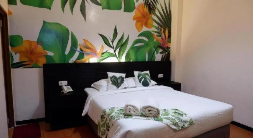 Bed in Tropical Point Hotel Syariah