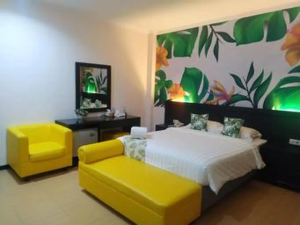 Bed in Tropical Point Hotel Syariah