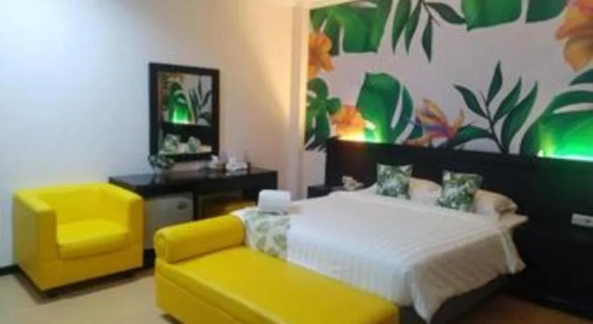 Bed in Tropical Point Hotel Syariah