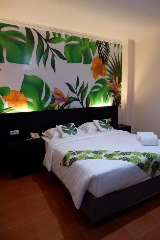 Bed in Tropical Point Hotel Syariah