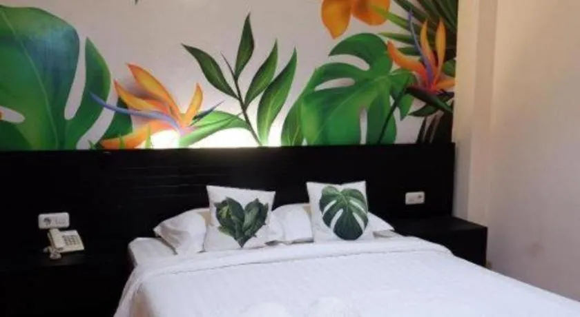 Bed in Tropical Point Hotel Syariah