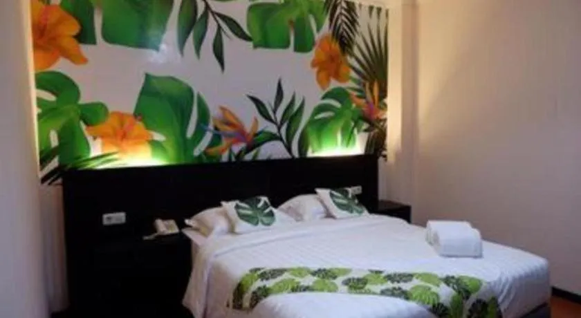 Bed in Tropical Point Hotel Syariah