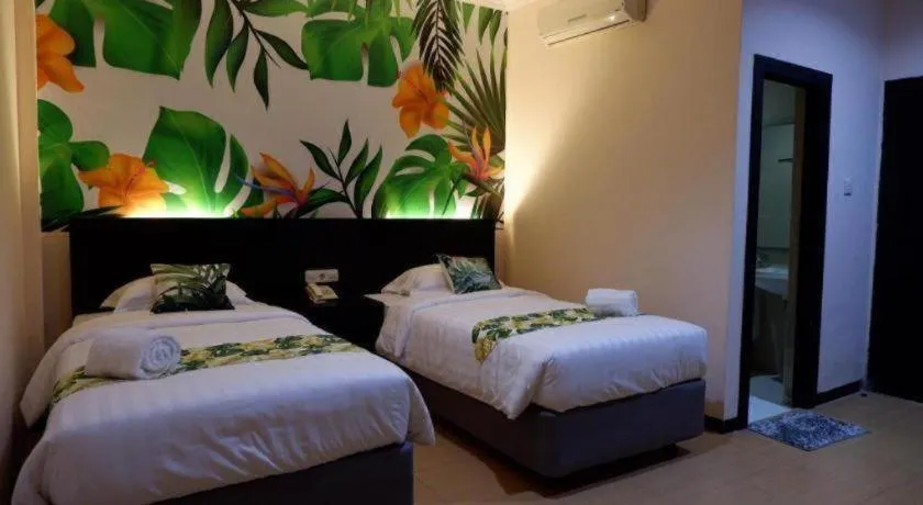 Bed in Tropical Point Hotel Syariah