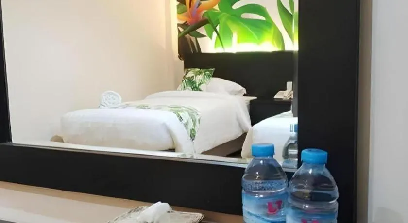 Bed in Tropical Point Hotel Syariah