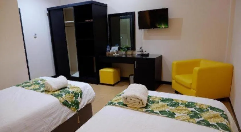 Bed in Tropical Point Hotel Syariah