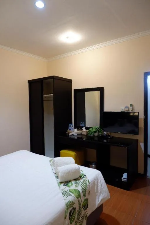 Bed in Tropical Point Hotel Syariah