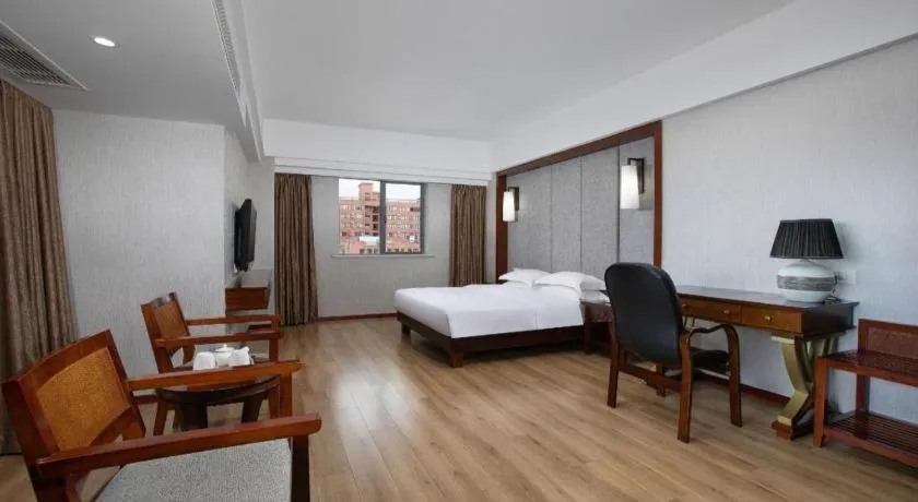 Bed in Ramada Encore by Wyndham Qionghai Downtown