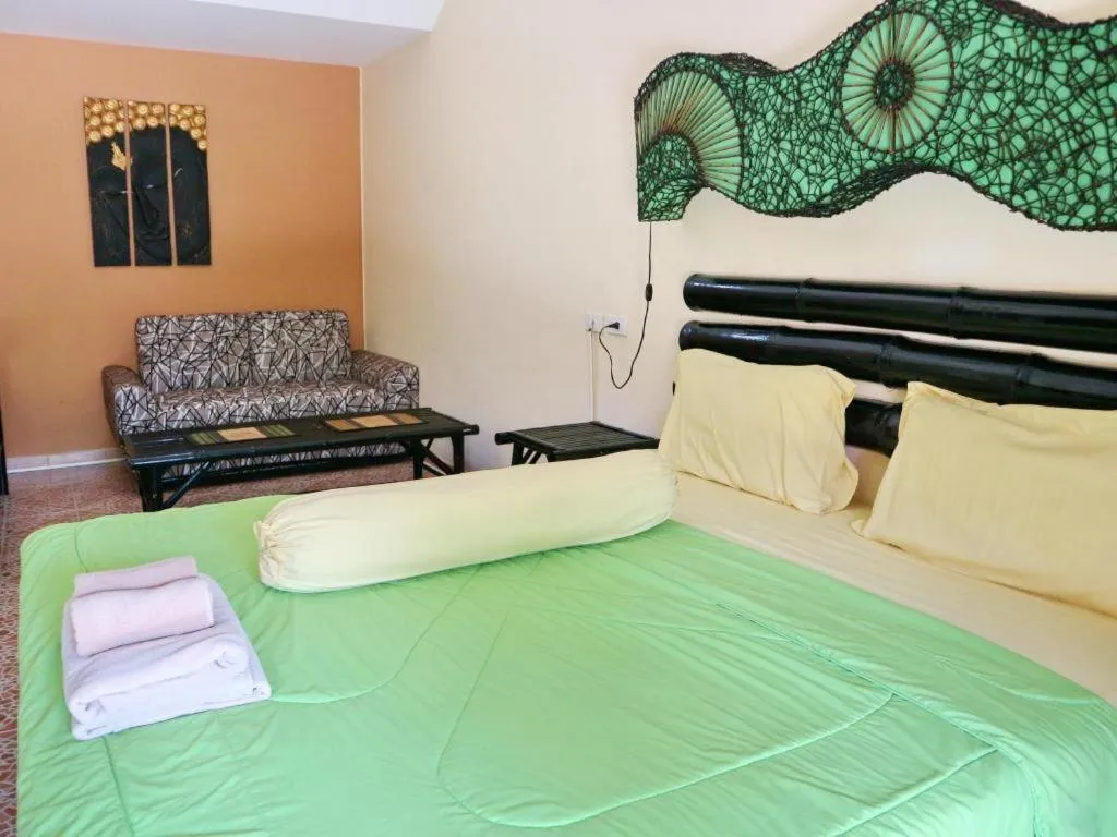 Bed in Kamala Tropical Garden Hotel