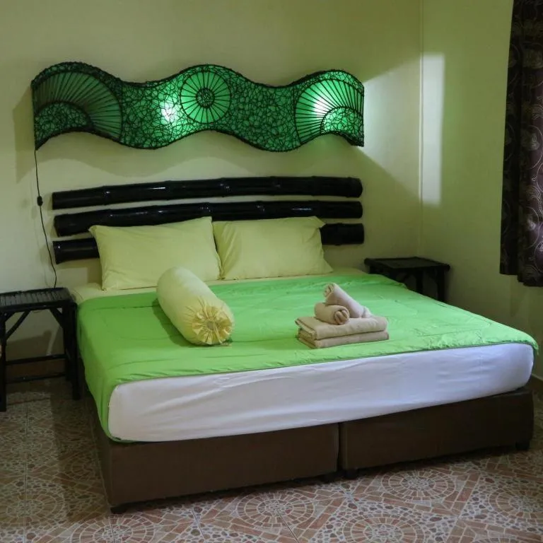 Bed in Kamala Tropical Garden Hotel