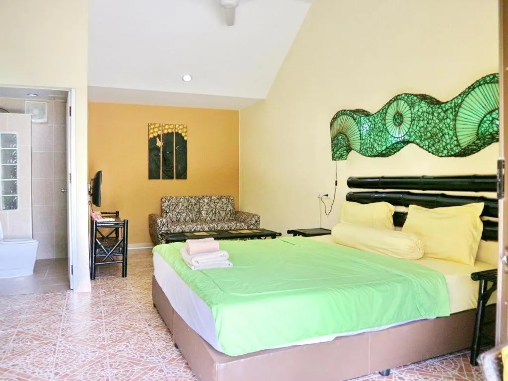 Bed in Kamala Tropical Garden Hotel