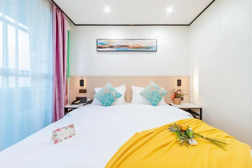 Bed in Xinghe Xinfeng Hotel Railway Station & Bus Station Branch