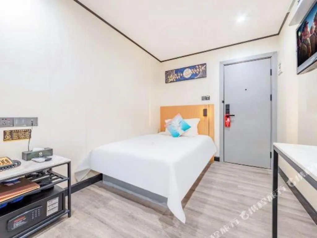 Bed in Xinghe Xinfeng Hotel Railway Station & Bus Station Branch