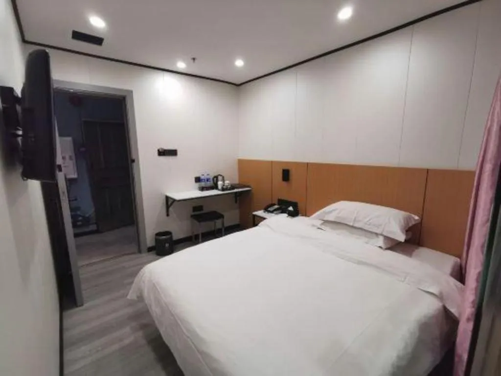 Bed in Xinghe Xinfeng Hotel Railway Station & Bus Station Branch