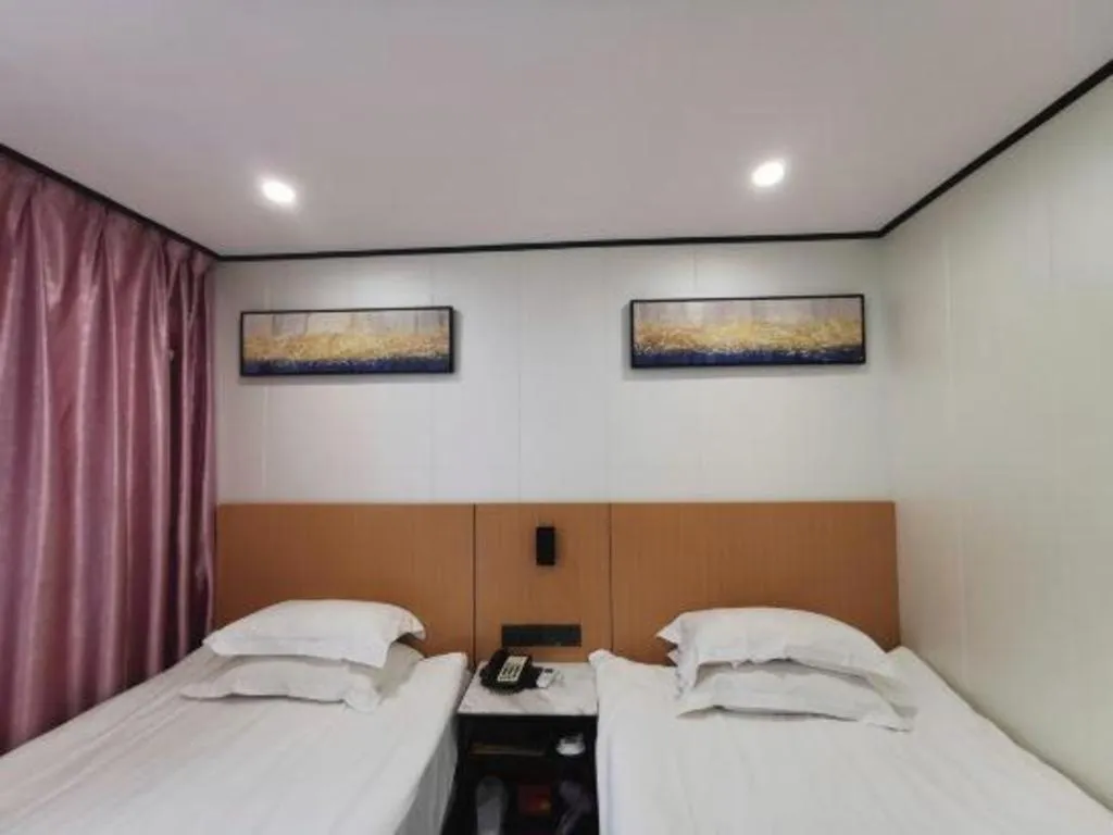 Bed in Xinghe Xinfeng Hotel Railway Station & Bus Station Branch