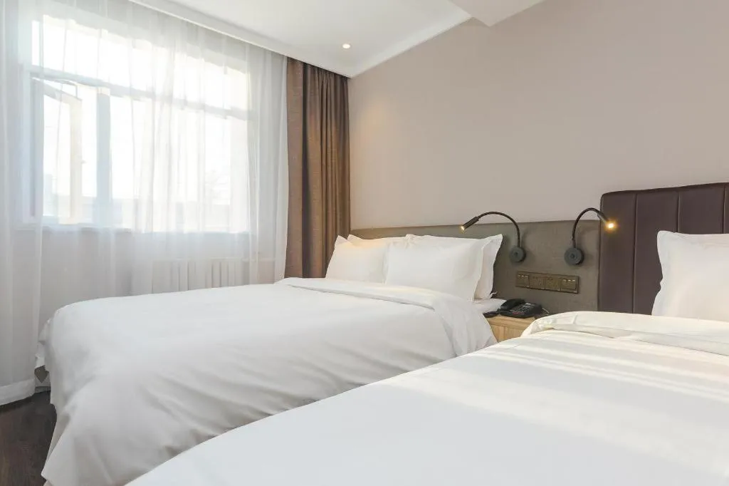 Bed in Hanting Premium Hotel Beijing Wudaokou East Gate of Tsinghua