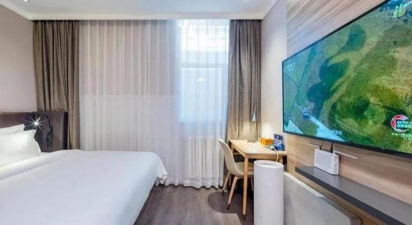Bed in Hanting Premium Hotel Beijing Wudaokou East Gate of Tsinghua
