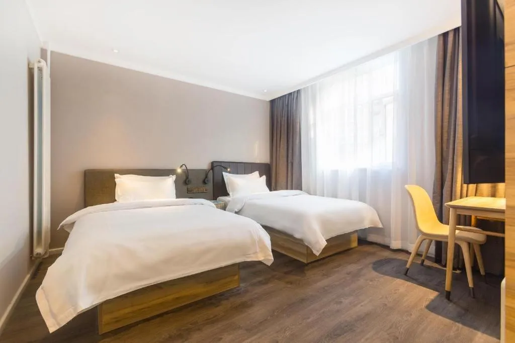 Bed in Hanting Premium Hotel Beijing Wudaokou East Gate of Tsinghua