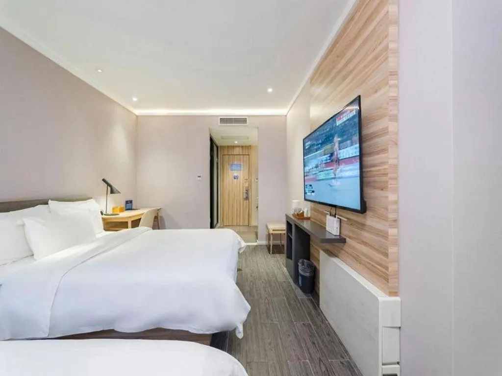 Bed in Hanting Premium Hotel Beijing Wudaokou East Gate of Tsinghua