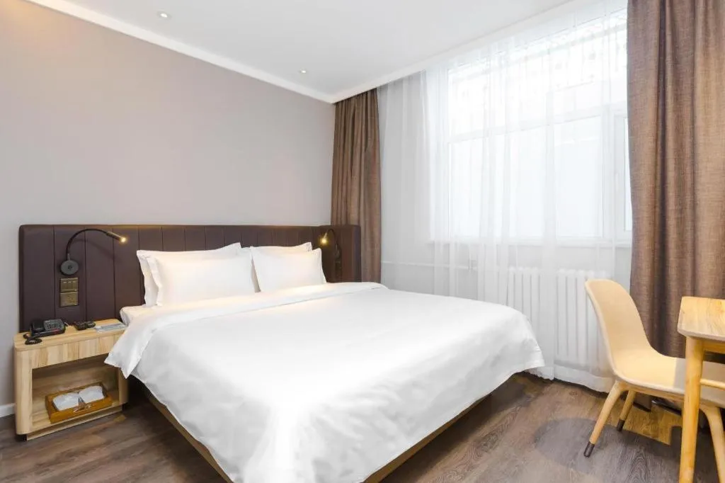 Bed in Hanting Premium Hotel Beijing Wudaokou East Gate of Tsinghua