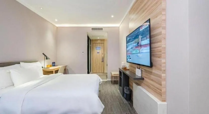 Bed in Hanting Premium Hotel Beijing Wudaokou East Gate of Tsinghua